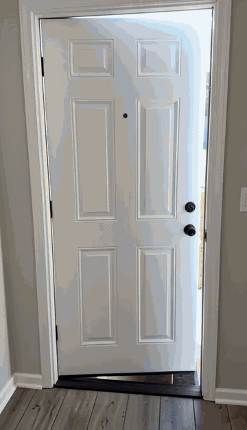Answering the door in the Godzilla robe